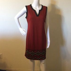 Red dress with a mix of black and cream at the end